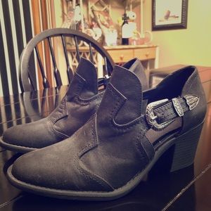 Black heeled booties with buckles